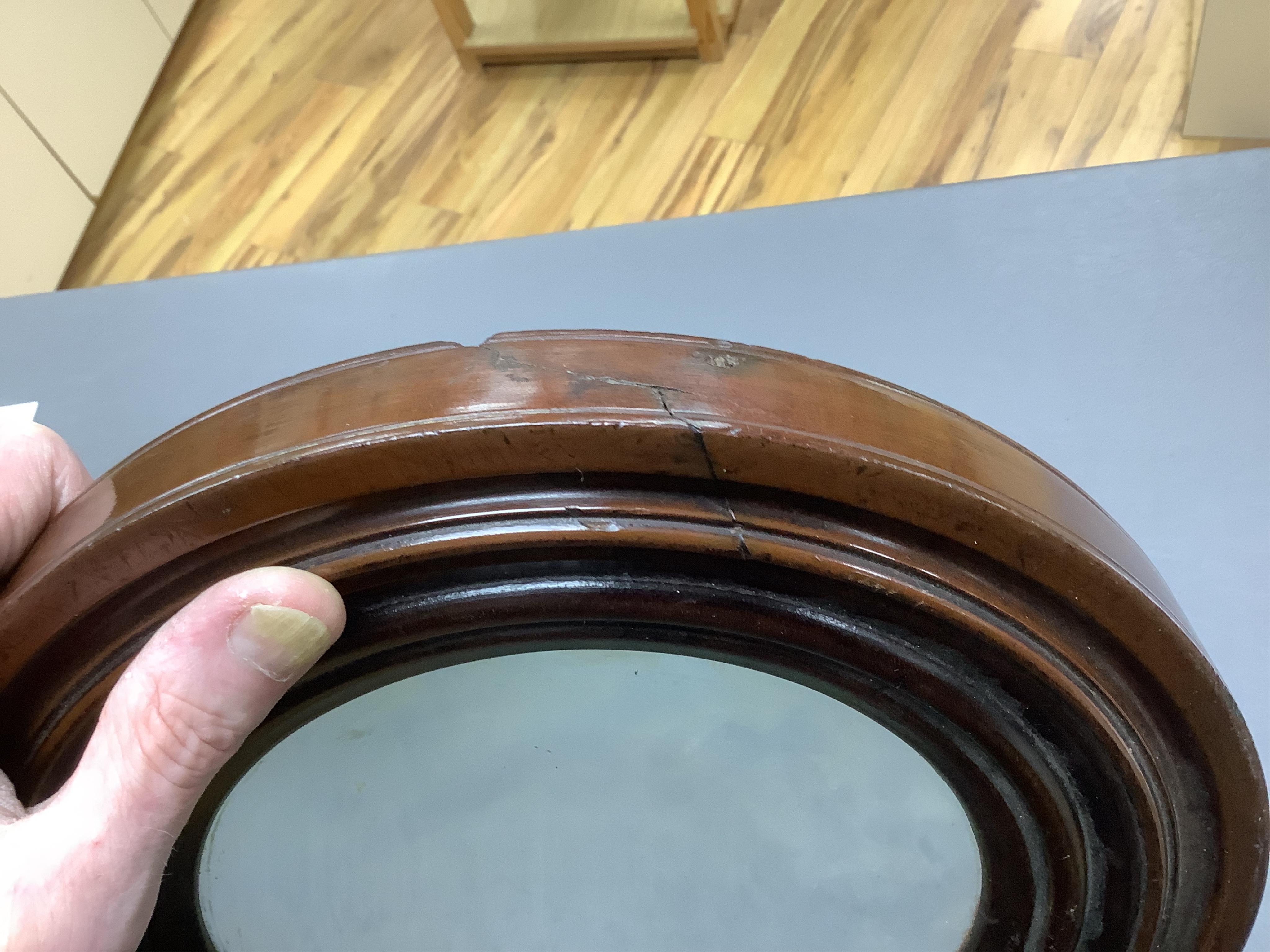 A large oversized 19th century fruitwood magnifying glass, 50cm in length